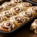 Pan of cinnamon rolls with cream cheese icing