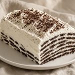 Sliced chocolate wafer icebox cake showing cream and cookie layers