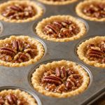 Pecan tassies in a mini muffin pan